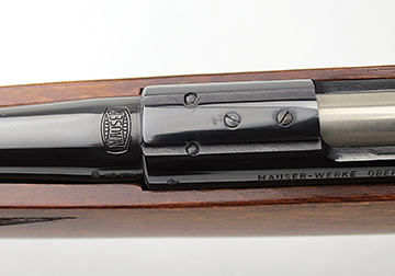 Screws show scope mount bases are an option to the 11mm grooves that accept rimfire tip-off rings. Also visible are the ends of two vertical pins attaching the barrel to the receiver.